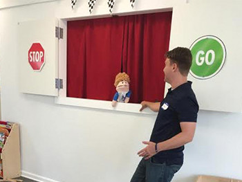 Pastor Daniel Schmidt participating in the puppet show